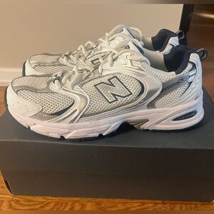 Never worn New Balance 530 White, Blue and silver sneakers sz 9 women/ 7 1/2 men